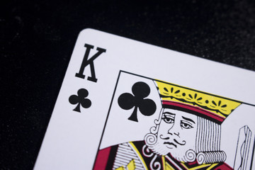 king poker card on dark black background