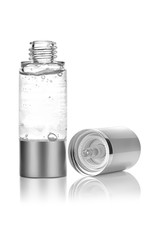 Moisturizing face serum for dry skin in metallic shiny open container with lid on the right side, reflected on the surface, isolated on white background, clipping path included