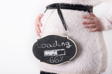 Photo of pregnant woman touching her belly