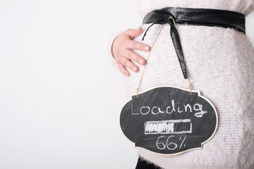 Photo of pregnant woman touching her belly