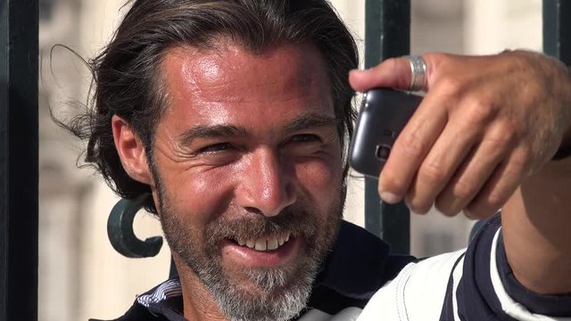Smiling Man Taking Selfy