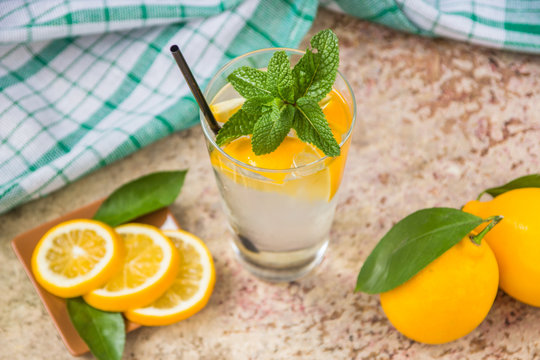 Fresh lemonade in glass with mint and ice