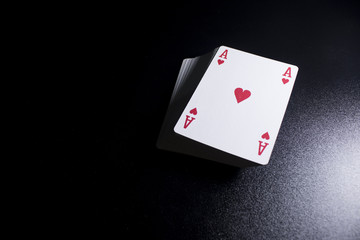 poker card stack deck on dark black background