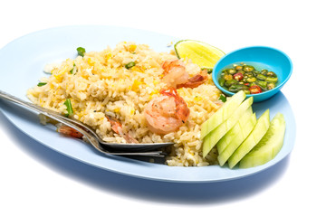 Fried rice with egg, sliced cucumber, lemon, chili and fish sauc