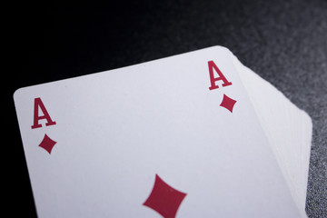 poker card stack deck on dark black background