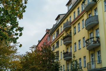 Fototapeta na wymiar Colorful townhouses with semi-circular balconies