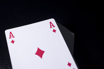 poker card stack deck on dark black background