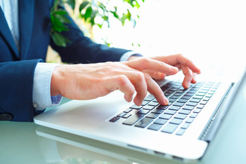 Men office worker typing on the keyboard