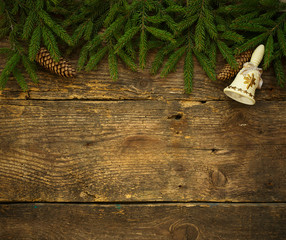 Christmas tree branches with cones and christmas decorations on