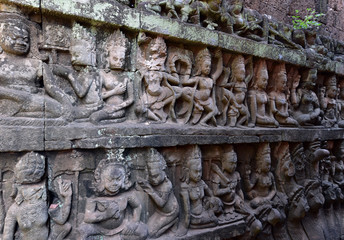 Khmer sculptures of Apsara Dance with Mahabharata carvings on the wall of Angkor Wat Temple, Siem Reap, Cambodia