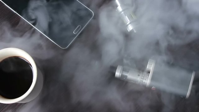 thick smoke lay down on the e-cigarette