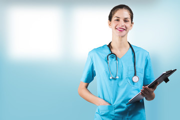 beautiful woman nurse or doctor is holding a notepad board with copy space for advertising