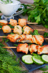 Skewers of chicken on wooden skewers