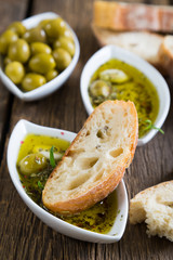 The bread dipped in olive oil with herbs and spices