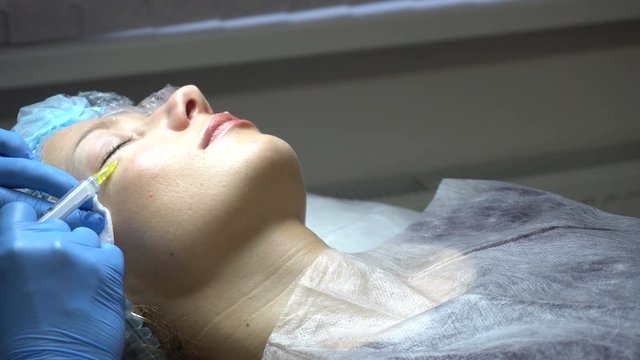 Young woman getting treatment in beauty saloon