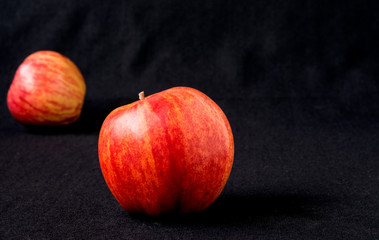 Red Apples on black background