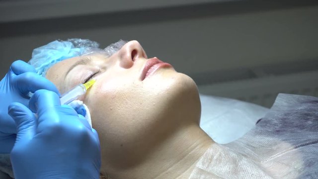 Young woman getting treatment in beauty saloon