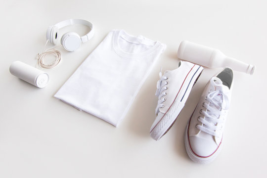 Blank stuff on white background. Template for design presentations. Branding Mock-Up. Shirt, sneakers, headphones, bottle.