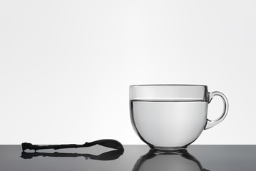 spoon and a cup of water