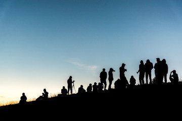 Group of people on peak mountain.