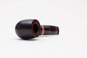 Classic smoking pipe isolated on white desk