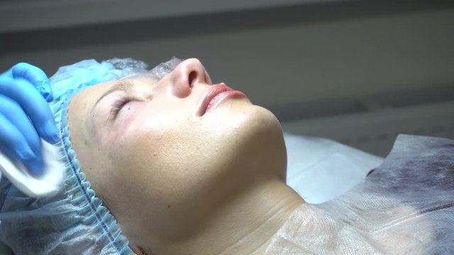 Young woman getting treatment in beauty saloon