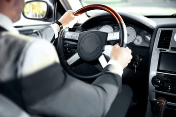 Chauffeur driving a car, view from inside