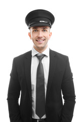 Young chauffeur standing on white background