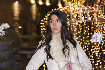 Fototapeta premium beautiful sad woman alone on the street on new year.Night outdoor scene