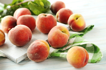 Fototapeta na wymiar Sweet peach fruit on white wooden table