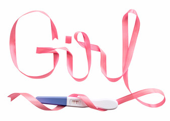 Word girl written gift ribbon pink. A positive pregnancy test. White background, isolated