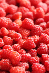 Ripe and sweet red raspberries background