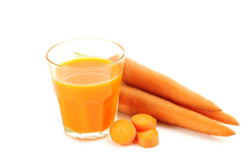 Fresh carrot juice in glass isolated on a white background