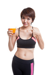 Beautiful Asian healthy girl point to orange juice.