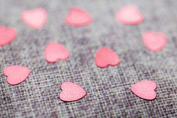 Macro Glitter Hearts on Fabric Background for Valentine 