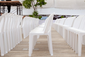 Plastic chair / Plastic white chair in row. Shallow depth of field.