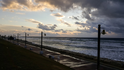 Fototapeta na wymiar Sunset, on promenade of Mediterranean Sea, winter, Haifa, Israel