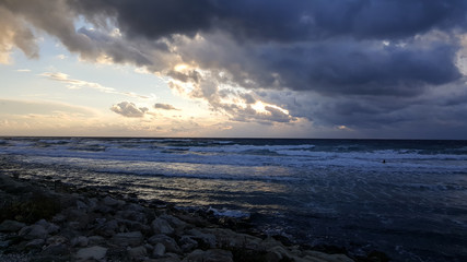 Fototapeta na wymiar Sunset, on promenade of Mediterranean Sea, winter, Haifa, Israel