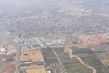 Old buildings, fields and new skyscrapers in Tel Aviv, Israel