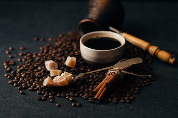 Coffee beans on black stone background