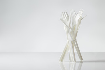 plastic cutlery on white