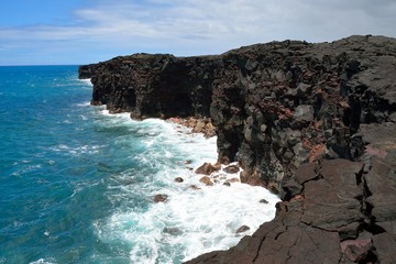 Fototapeta na wymiar Volcanic rocky coast rough ocean waves, Big Island, Hawaii