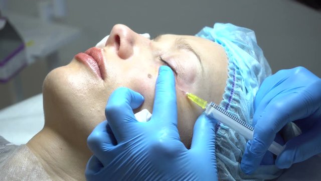 Young woman getting treatment in beauty saloon