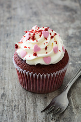 Valentine cupcakes on wooden background
