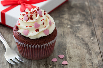 Valentine cupcakes on wooden background
