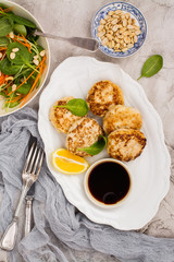 Chicken patties on white dish
