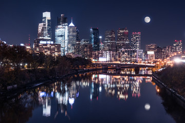 Fototapeta na wymiar Moon over the Philadelphia Night Skyline