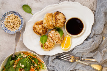 Chicken patties on white dish