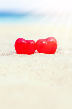 Valentines day card, hearts on beach