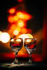 two wine glasses and defocused lights at the restaurant